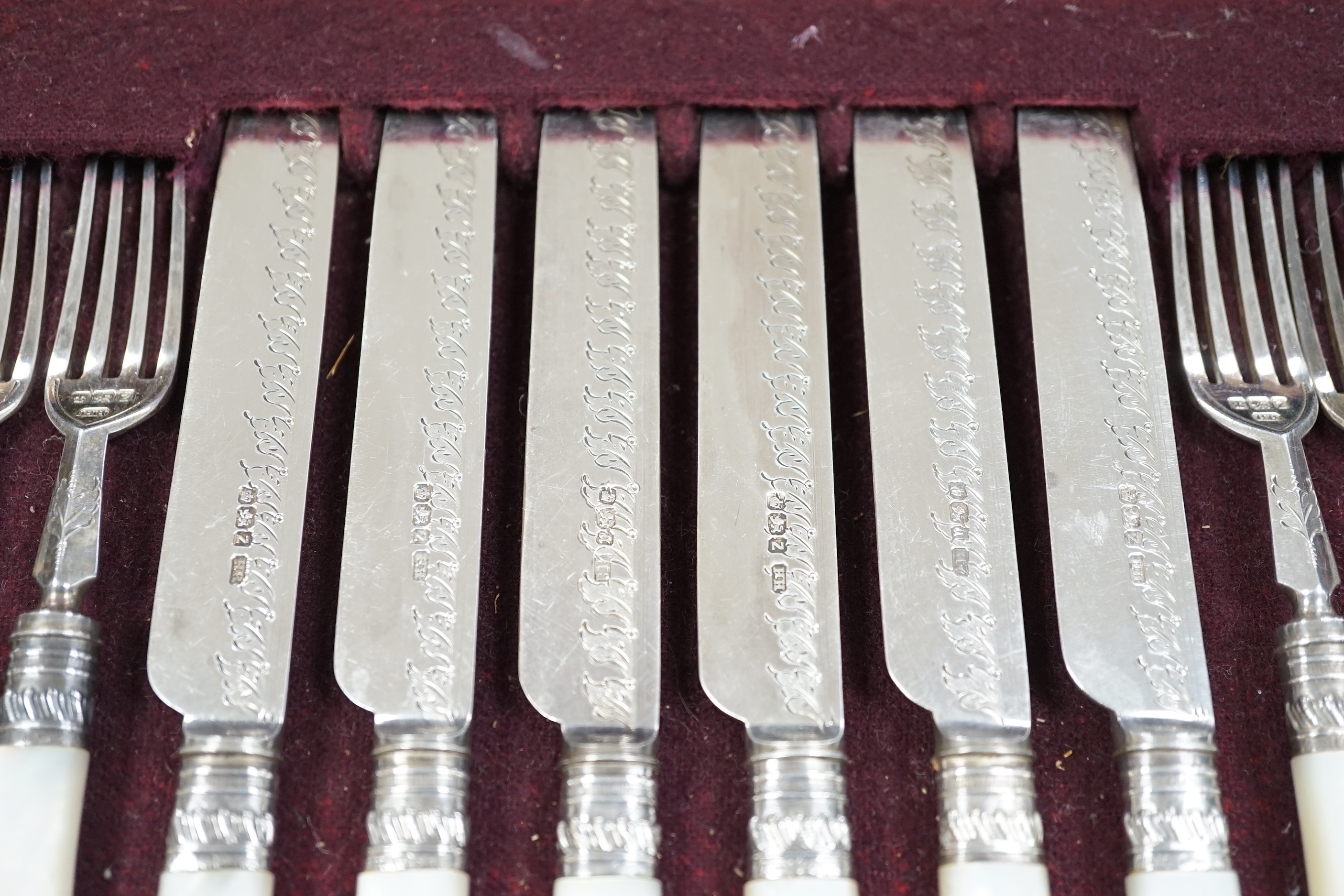 A cased set of twelve pairs of late Victorian mother of pearl handled silver dessert eaters, by Henry Harrison, Sheffield, 1892/3, knife 20cm.